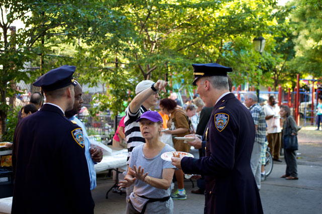 Members of the community discussing with NYPD officers at the Night Out Against Crime