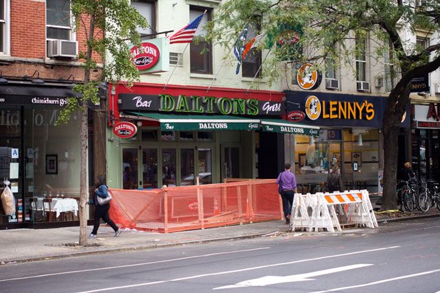 The sidewalk being rebuilt outside Dalton's Bar & Grill