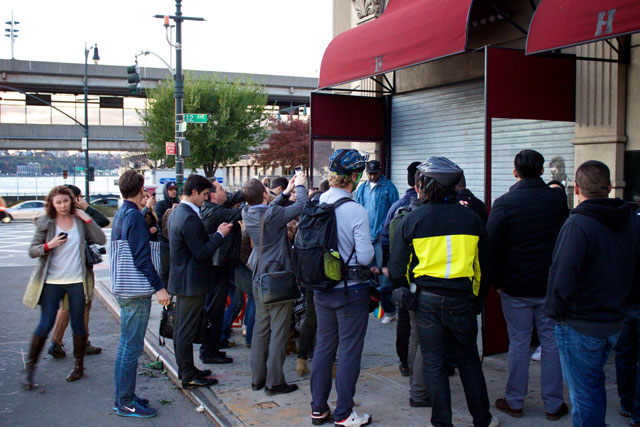 The crowd of people viewing the Banksy piece