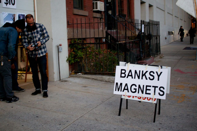 Cheap unofficial Banksy memorabilia for sale near the artwork