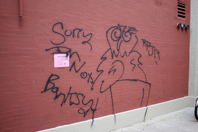 Graffiti next to the Hanksy artwork