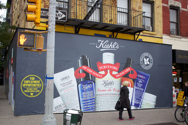 The branded plywood surrounding the future Kiehl's store