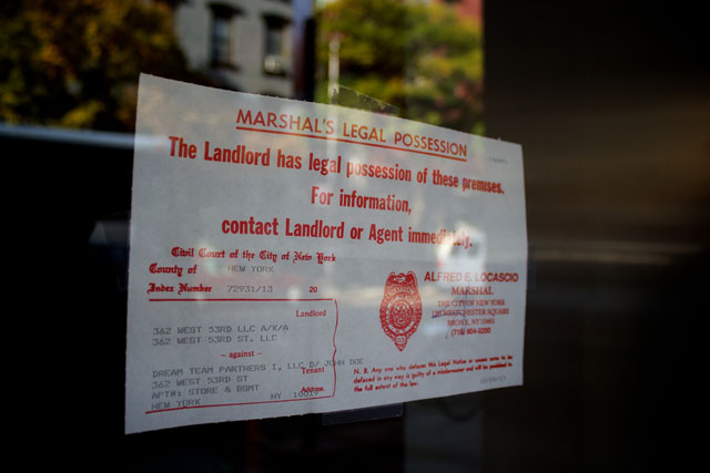 The notice of legal possession on the window of La Silhouette