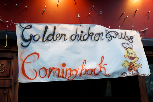 The signage announcing the future home of Golden Chicken & Ribs