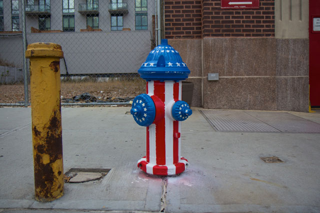 A painted fire hydrant styled with the US Flag
