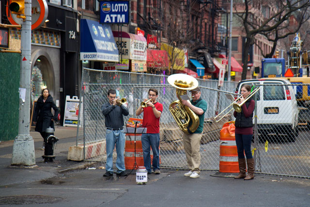 A brass quartet performing on the street