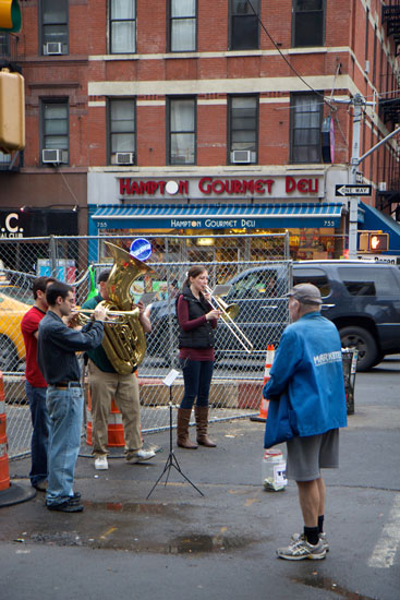 A brass quartet performing on the street