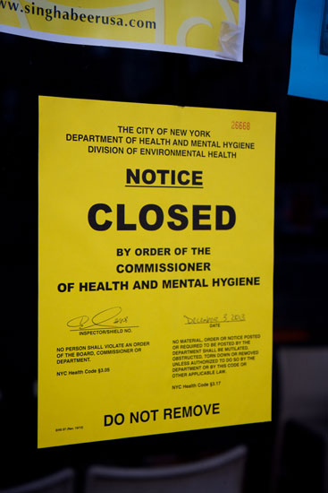 The health department notice on the window of Breeze