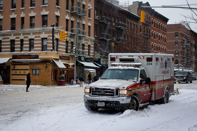 An ambulance parked in the snow