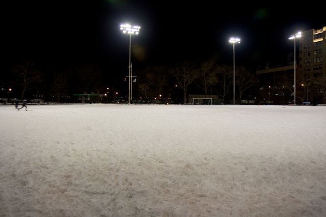 The field at DeWitt Clinton Park covered in snow