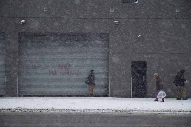People walking through heavy snowfall