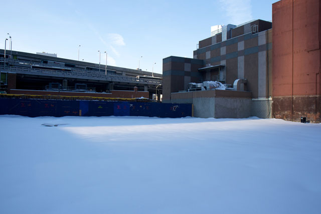 A field of snow covering the future Times Square Hotel site