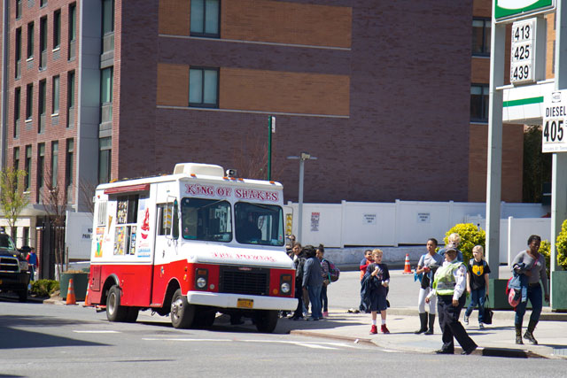 Children lining up at an ice cream truck