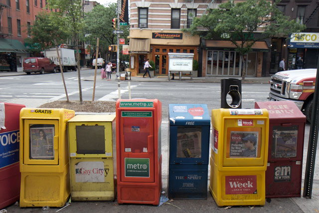 A row of newspaper stands along 9th Avenue