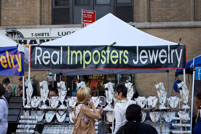 A "Real Imposters Jewelry" stall at the 8th Ave street fair