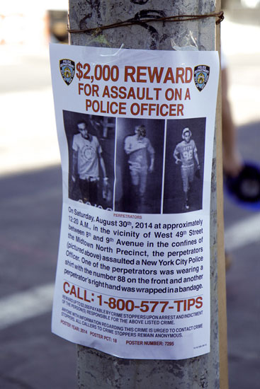 A flyer calling for information on an assault on a police officer