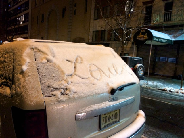 The word "love" written in snow