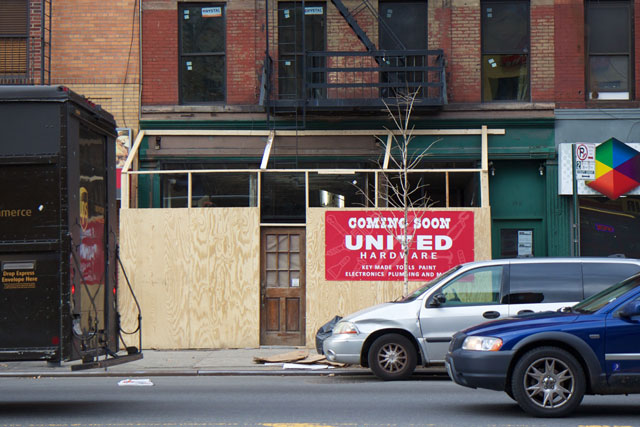 The exterior of the incoming United Hardware covered by plywood